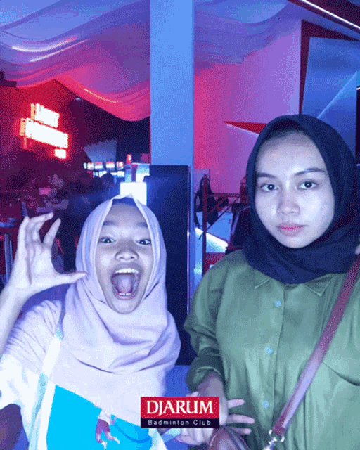 two girls are posing for a picture with the word djarum on the bottom