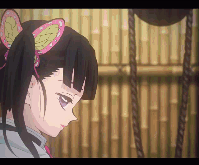 a close up of a girl with a butterfly ear cuff
