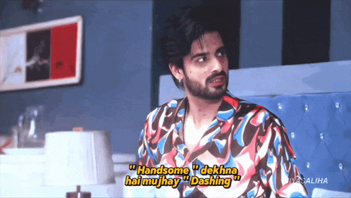 a man in a colorful shirt says handsome dekha hai mujhay