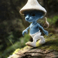 a smurf wearing a mushroom hat and carrying a snail on his back is walking on a rock .