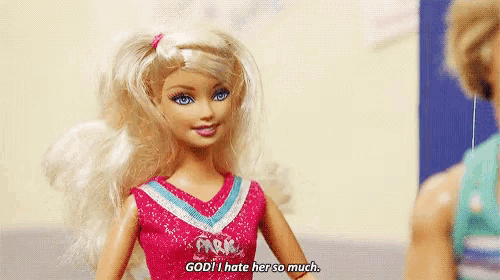 a barbie doll says " god i hate her so much " in a cheerleader outfit