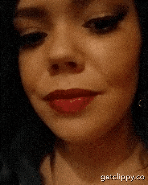 a close up of a woman 's face with red lipstick and the words getclippy.co below it