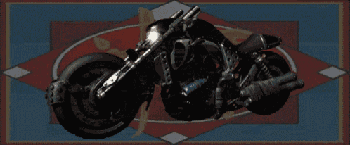 a black motorcycle is sitting on a blue and red carpet