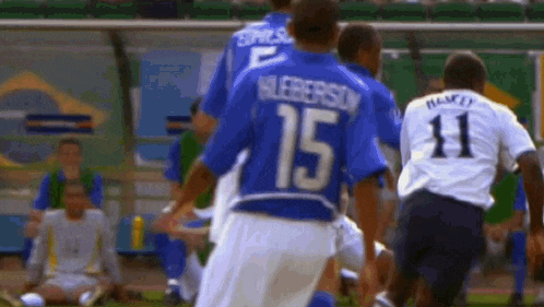 a soccer player in a blue jersey with the number 15 on it