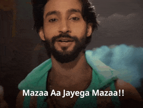 a man with a beard is smiling and says mazaa aa jayega mazaa