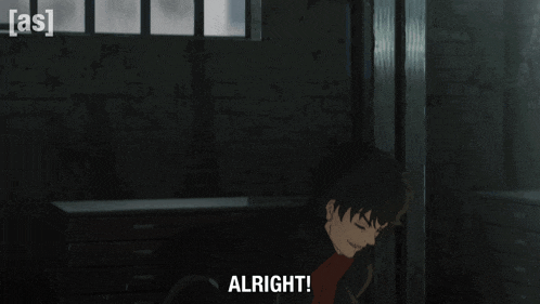 a man in a black jacket says " alright "