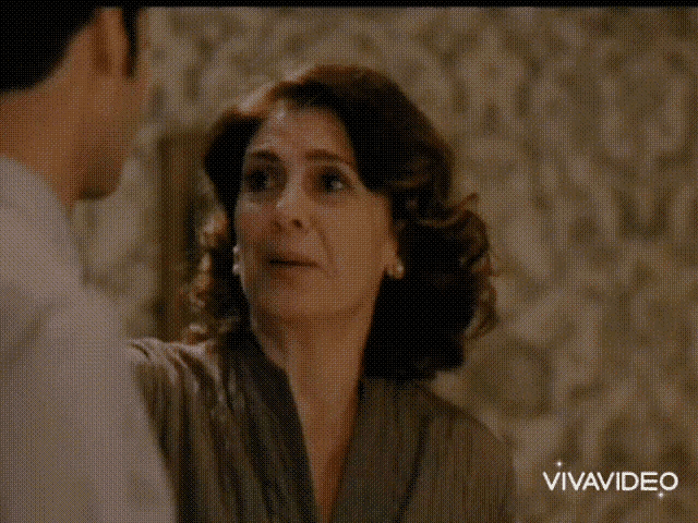 a man and a woman are looking into each other 's eyes in a video that was made by vivavideo