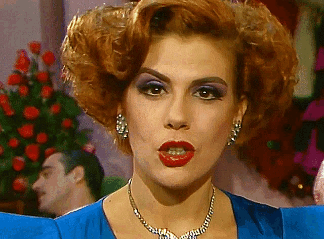 a close up of a woman wearing a necklace