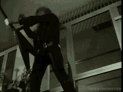 a man is playing a guitar in a room with the words giant monster written on the bottom