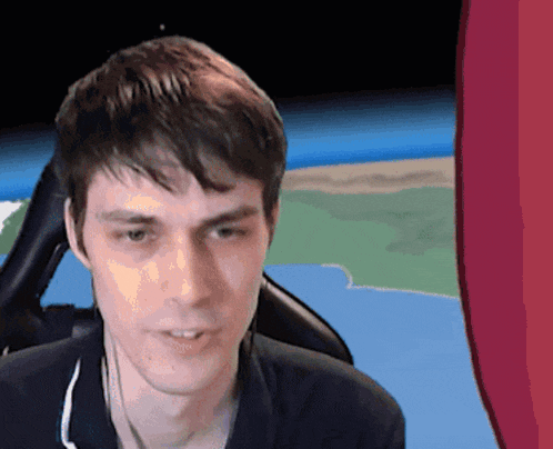 a man wearing headphones looks at the camera with a cartoon background in the background