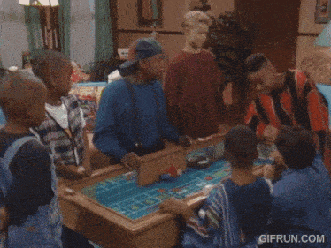a group of young boys are playing a game of roulette with the website gifrun.com at the bottom of the screen