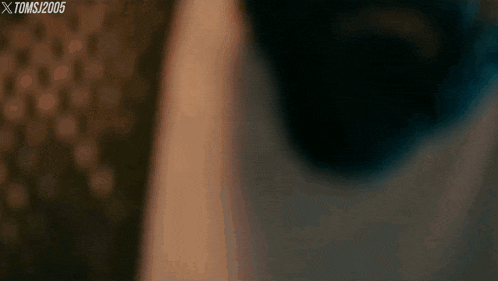 a close up of a person 's face with a watermark that says xtomsj2006