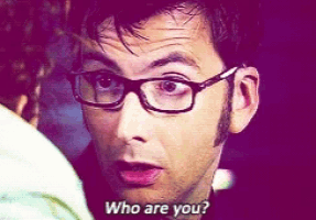a man with glasses says who are you