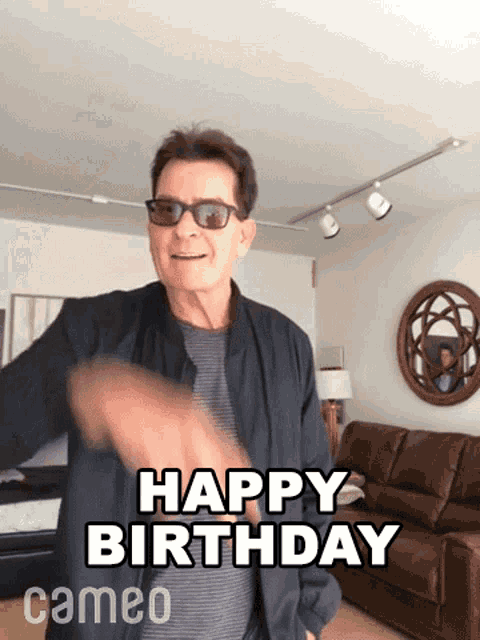 a man wearing sunglasses says happy birthday