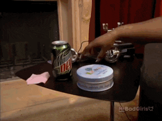 a can of mtn dew sits on a table