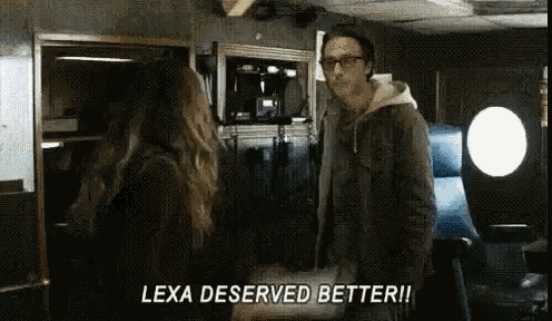 a man and a woman are standing in a room and lexa deserved better