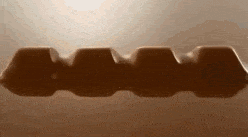 a close up of a chocolate bar with a light shining through it