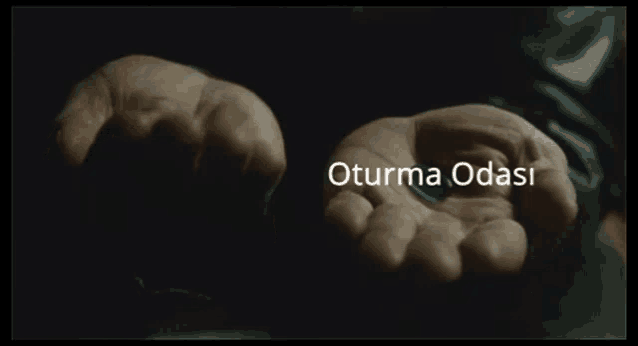 two hands holding a red pill and a blue pill with the words oturma odasi