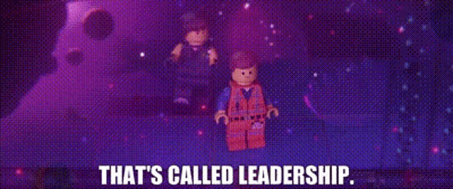 a couple of lego figures standing next to each other in a dark room with the words `` that 's called leadership '' .