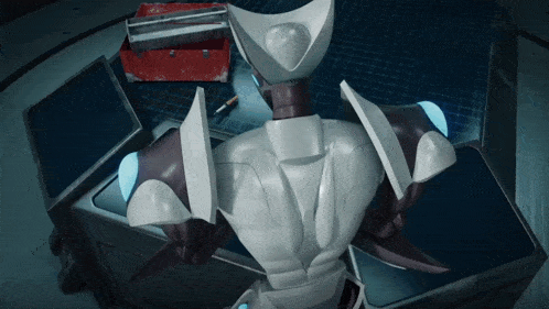 a robot is sitting in front of a toolbox