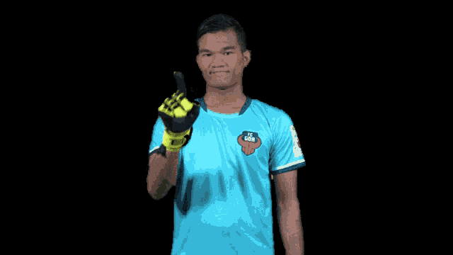 a soccer player wearing a blue shirt with a lion logo on it