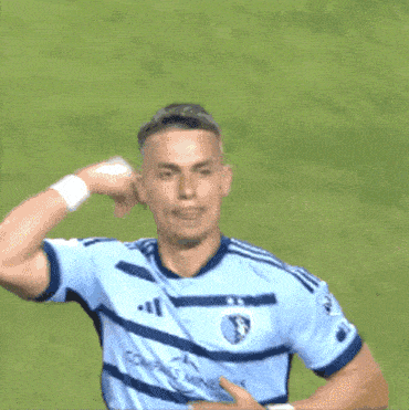 a soccer player wearing a jersey that says allianz on it