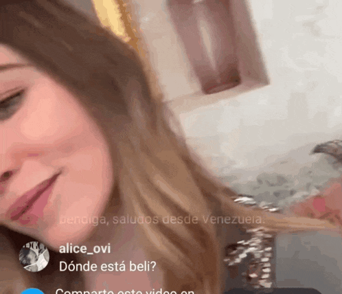 a close up of a woman 's face with the name alice_ovi at the top