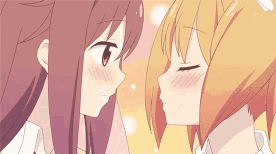 two anime girls are kissing each other on the cheek