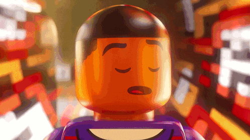 a lego man with his eyes closed and a purple shirt on