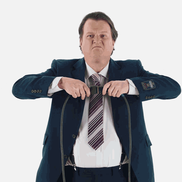 a man in a suit has a label on his jacket that says ' abercrombie & fitch '