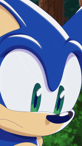 a close up of a sonic the hedgehog 's face with green eyes