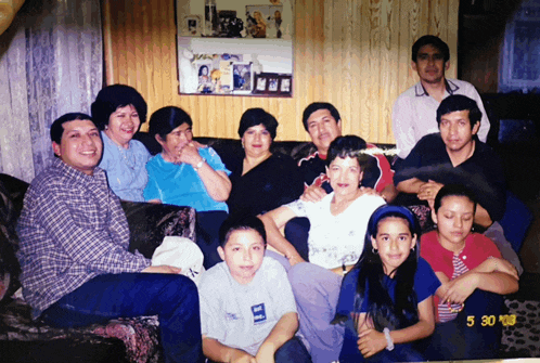 a group of people posing for a picture with the date 5 30 98 on the bottom
