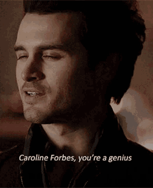 a close up of a man 's face with the words caroline forbes you 're a genius below it