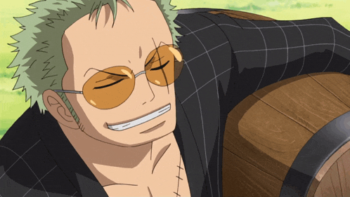 a man wearing sunglasses and a plaid shirt is smiling with his eyes closed