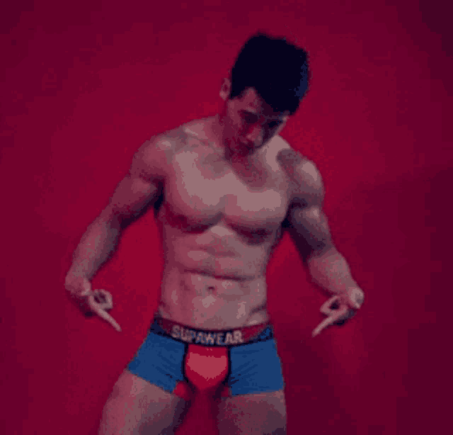 a shirtless man wearing blue and red boxer shorts with the word supawear on the waistband