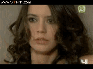 a close up of a woman 's face with the website www.s7rny.com at the top