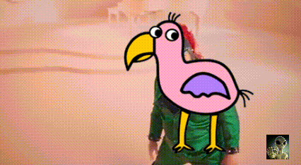 a pink bird with a yellow beak is standing next to a person in a green shirt