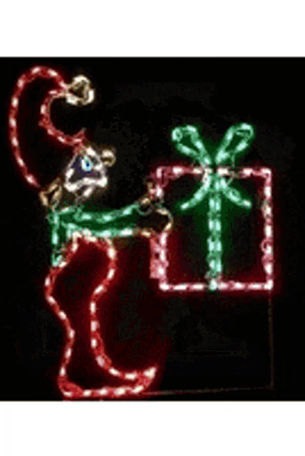 a christmas light display of a clown holding a gift box