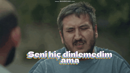 a man with his hands on his head and the words seni hic dinlemedim ama on the bottom