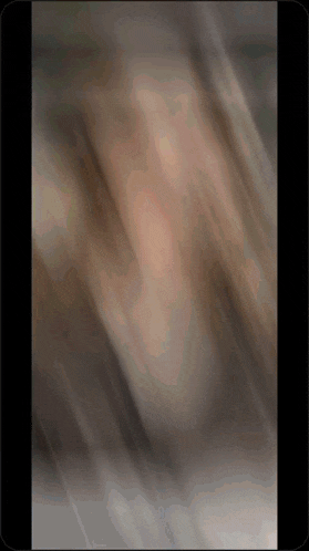 a blurred image of a person 's face on a cell phone