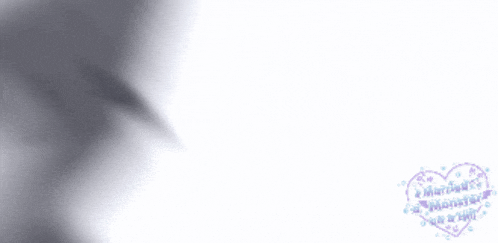 a blurred image of a man and woman with a heart that says " what a monster " on it