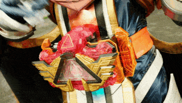 a close up of a person wearing a costume with a belt that has a triangle on it