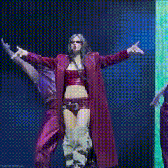 a couple of people are dancing on a stage