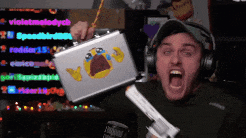 a man is holding a briefcase with a crying face on it