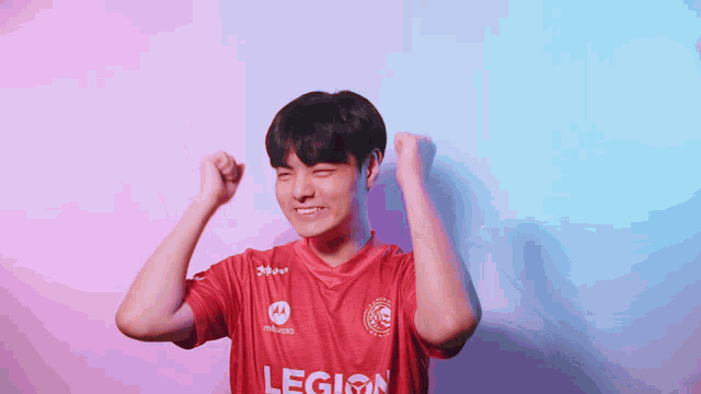 a young man wearing a red legion jersey