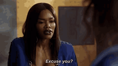 a woman in a blue jacket is talking to another woman and says `` excuse you ? ''