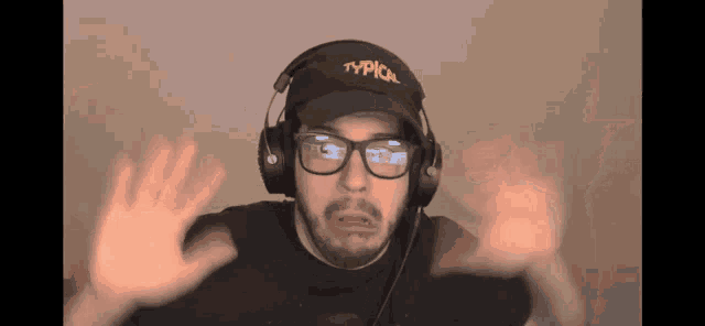a man wearing headphones and a typical hat