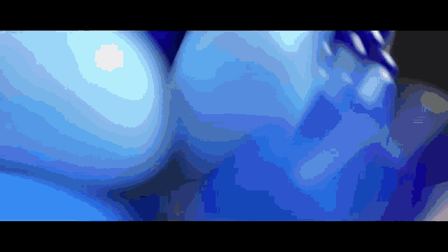 a close up of a blue and purple object