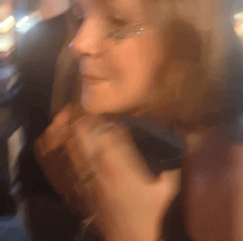 a close up of a woman 's face with glitter on her face