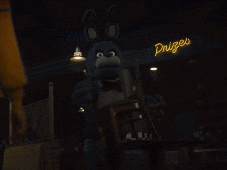 a blue bunny is standing in front of a neon sign that says prizes